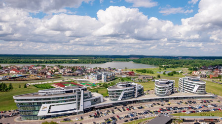 Minsk, Belarus - July 20, 2022: Modern architecture of a business center and residential area in the northwest of Minsk near the Svisloch River and the Drozdy reservoir. View from the heightのeditorial素材