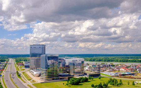 Minsk, Belarus - July 20, 2022: Modern architecture of a business center in the northwest of Minsk near the Svisloch River and the Drozdy reservoir. View from the heightのeditorial素材