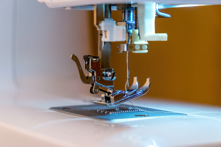 <p>Part of the sewing machine. Close-up of the needle and sewing foot. Sewing production</p>の写真素材