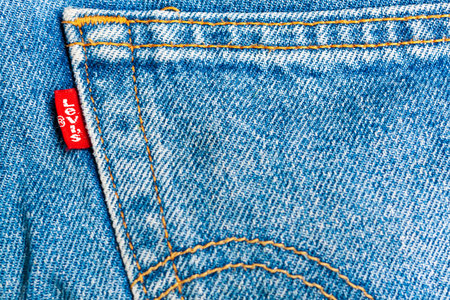 Minsk, Belarus - June 02, 2014: Denim background with Levi's logoのeditorial素材