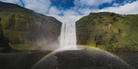 Iceland waterfall Skogafoss in Icelandic nature landscape at summer timeの写真素材