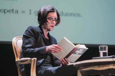 Vilnius Lithuania - April 11 2011 Herta Muller is reading her book on theater stage.のeditorial素材