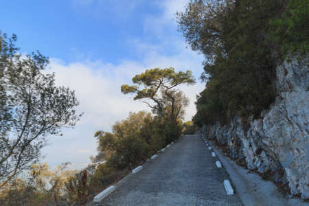 Road on the edge of cliff drive to The Rock Gibraltar summer seasonの写真素材