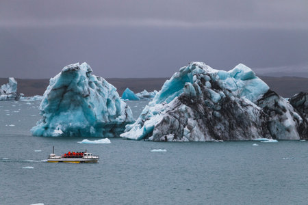 Huge iceberg and resque boat in Iceland Jokulsarlon