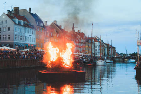 Copenhagen, Zealand Denmark - June 23 2019: Burning The witch on bonfire the middle of Nyhavn canal during Sankthans evningのeditorial素材