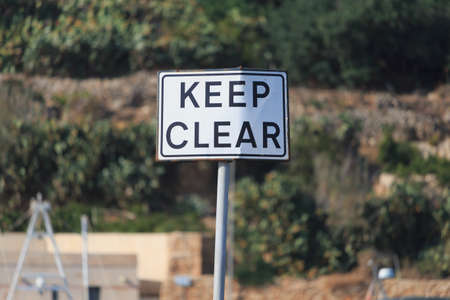 Keep clear road sign on blur background, horizontalの写真素材