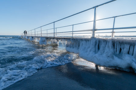 Icicles under the pier in Denmark day timeの写真素材