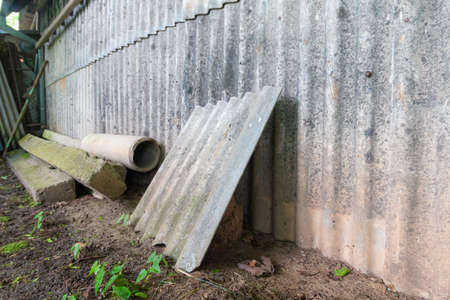 Asbestos tiles on the wall. Nature pollution dangerousの写真素材