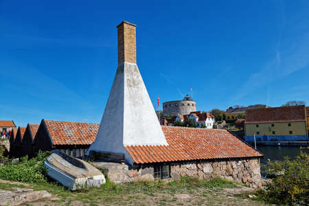 Unique triangle shape chimney made to Smoke Fish. Small island in Baltic sea.のeditorial素材