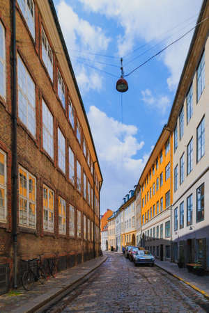 Two locked bicycycles in Copenhagen colorful old town street at summer seasonの写真素材