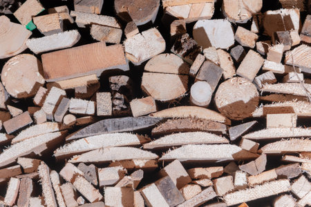 Chopped wooden logs stacked in the woodpile Background
