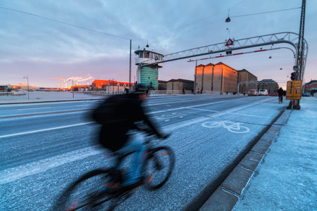 Cycling in Copenhagen during the winter season. Bicycle path over Langebro bridge.