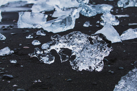Crystal clear ice on beach in jokulsarlon lagoon Iceland