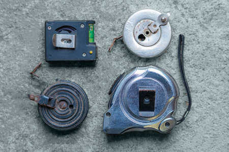 few different measure tapes on floor- various measure tapes..の写真素材