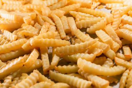 French fries are cooking in the oven.