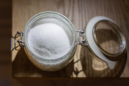 Granulated sugar in glass jar container - Sugar jar