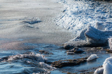 Frozen snow in beach day time at Denmark close up