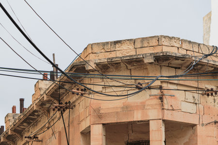 Messy electrical cables on buildings in Malta