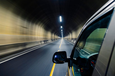 Driving in the tunnel in Norway - car mirror on the side
