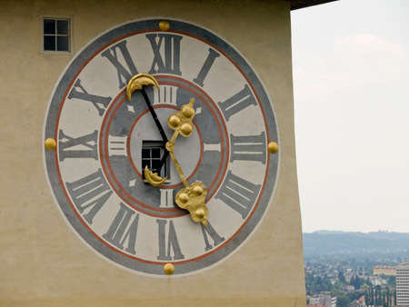 Clock tower perspective with golden arrows.の写真素材