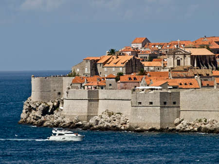 Dubrovnik old town panorama. Summer sunny day with boat passing by.の写真素材