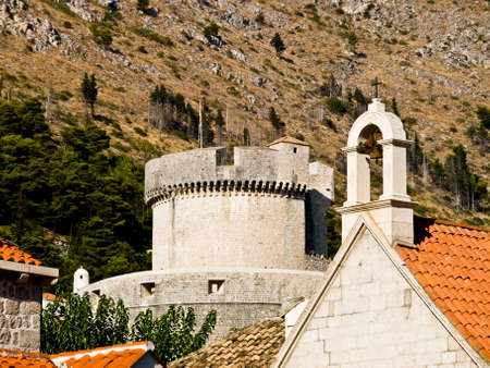 Dubrovnik old town walls detail. Fortress "Minceta" in the Back and church in the front.の写真素材