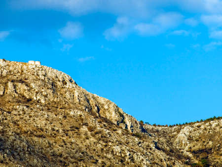 Sky and hill forming mathematical sine curve.の写真素材