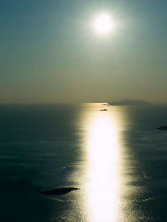 Sunset at Adriatic sea. All kind of transportation in the air and on the water.の写真素材