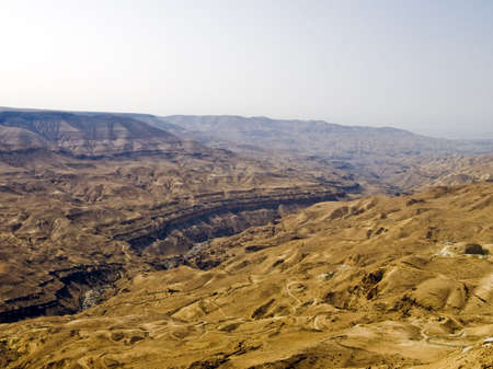 River canyon landscape in Jordan. Small river. Hill-side slope also going down in perspective (that is why horizon is not horizontal)の写真素材