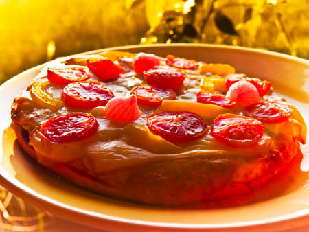 Vegetarian Pizza close up with tomato and onion detailの写真素材