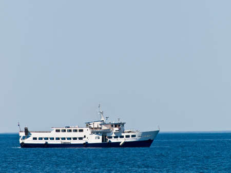 Tourist ship against blue horizonの写真素材