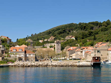 Small village in Dubrovnik area,  island Sipan, Croatia, Europe. Old patrician resort from Dubrovnik Republic in the middle of village.の写真素材