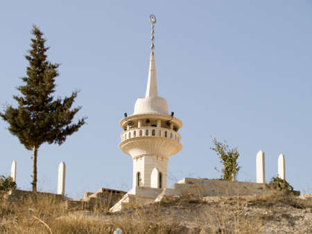 Syrian mosque tower in back and cemetery in front. Focus on the mosque.の写真素材