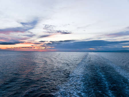 Adriatic sea sunset with cloudsの写真素材