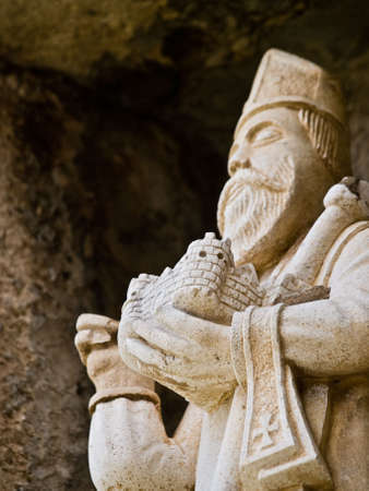 Old sculpture detail of the saint Blaiseの写真素材