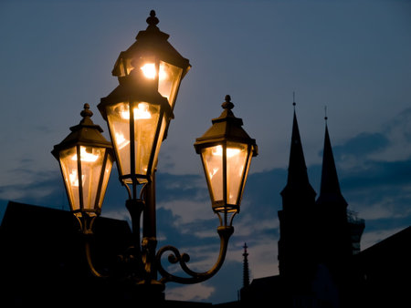 Nuremberg (NÃ¼rnberg) - Church  silhouette with street lights in frontの写真素材