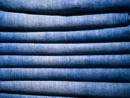 Stack of blue jeans. Close up shot.の写真素材