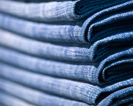 Stack of blue jeans. Close up shot.の写真素材