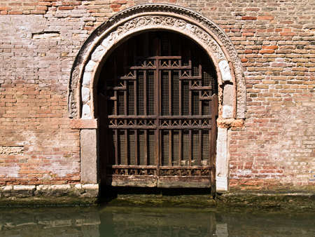 Small narrow street canal of Venice, Italyの写真素材
