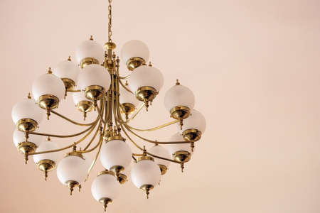 Big chandelier on the wall - interior detail.の写真素材