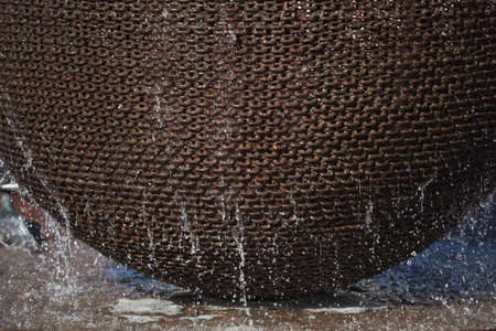 Fountain detail with metalchains and water dropsの写真素材