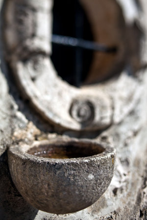Selective focus shot of an detail of Holy water on old church. Korcula island, Croatia, Dalmatia...