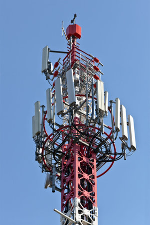 GSM mobile antenna detail against a blue sky