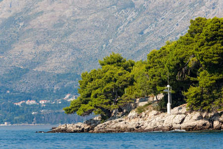Forest ending by the sea, Cavtat, Croatiaの写真素材