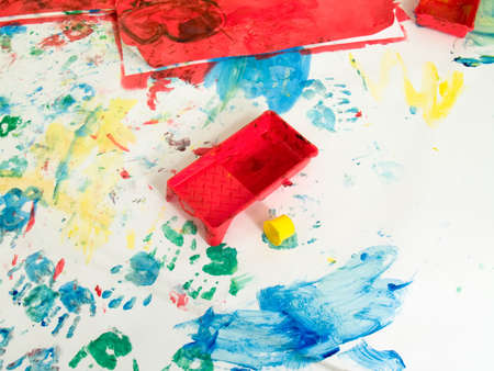 Children hand prints with toys on hand painting playground. On whiteの写真素材