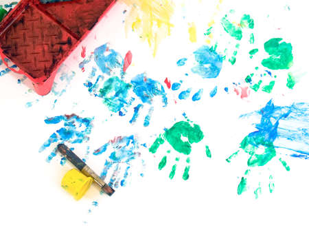Children hand prints with toys on hand painting playground. On whiteの写真素材