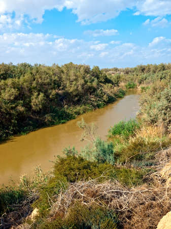 River Jordan in Bethany, border between Jordan and Israelの写真素材