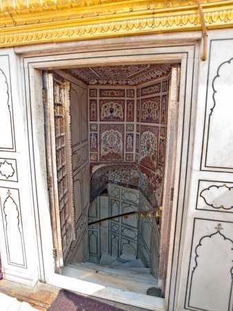 Golden Temple. Holiest shrine of the Sikh religion. Ornate gold covered building in the middle of an artificial lake in Amritsar, Punjab, India.の写真素材