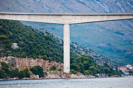 Bridge piers detail on the sea shore. T shape.の写真素材