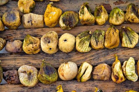 Early stage in preparation of dried figs, typical traditional Mediterranean food.の写真素材